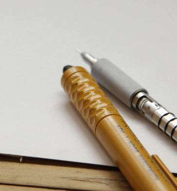Pencil and Eraser sits on a blank piece of paper