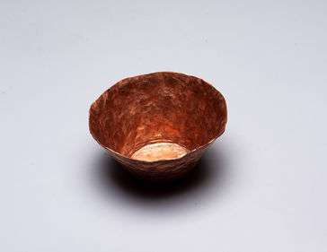 A copper formed cup