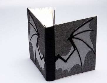German case binding with two hand sewn bat wings on cover 