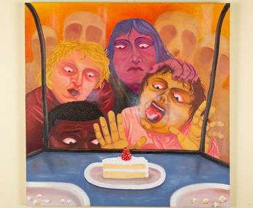 four figures surrounding a cake